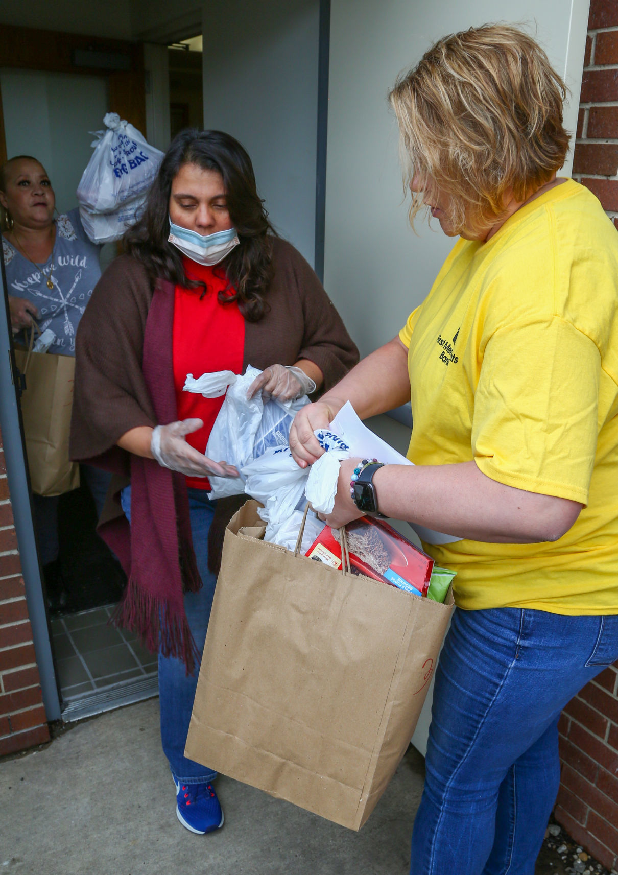 Volunteers from various organizations picking up food and delivering it to senior citizens.